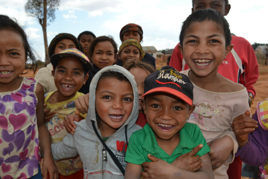 A group of children smile in Madagascar