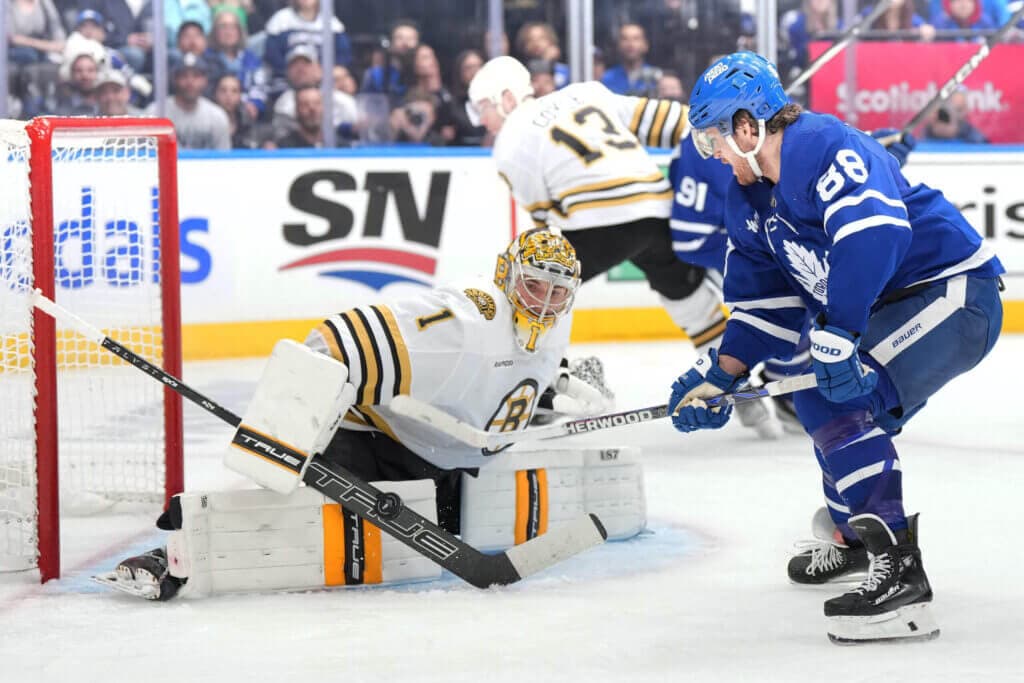 Apr 27, 2024; Toronto, Ontario, CAN; Toronto Maple Leafs right wing William Nylander (88) battles for the puck in front of Boston Bruins goaltender Jeremy Swayman (1) during the third period in game four of the first round of the 2024 Stanley Cup Playoffs at Scotiabank Arena. Mandatory Credit: Nick Turchiaro-USA TODAY