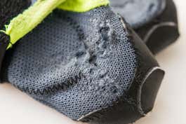 The sole of a Healer boot, with holes in the mesh along seams.