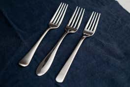 Three different style of flatware finish examples on three different forks.