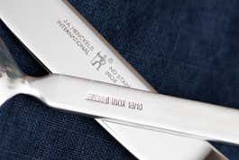 A close up of some of the markings on a flatware set.