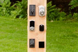 Six locks we tested, installed on a wooden post.