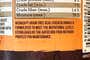 A close-up of the ingredients list on the back of a can of dog food.