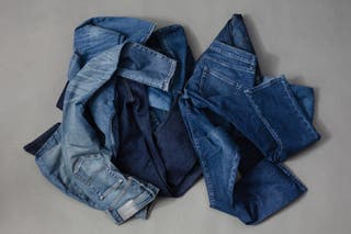 A pile of men's jeans we tested for this review.
