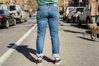 A rear view of a tester modeling the Buck Mason Ford Standard Jeans.