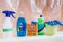A variety of cleaning supplies needed to clean a shower curtain, shown side by side.