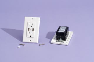 Our favorite in-wall smart outlet, the Geeni Current+Charge, shown next to the Top Greener in-wall WiFi charging outlet.
