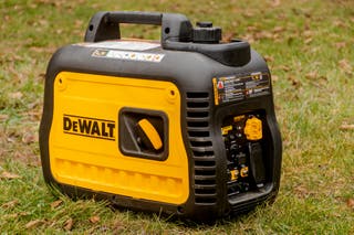 A DeWalt DXGNI2200 portable power generator turned so that its control panel is visible