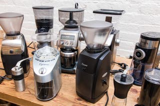 The various coffee grinders we tested on a kitchen counter.