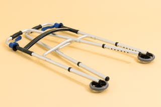 The Drive Deluxe Trigger Release Folding Walker in its collapsed, folded-up position.