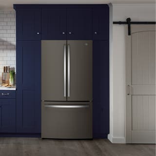 Our pick for best french-door refrigerator that is on the larger side, the GE GNE27J, shown in a slate finish, installed among some cabinets in a kitchen setting.