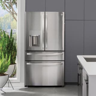 Our pick for best french-door refrigerator that has four doors and extra compartments, the GE Profile PVD28BYNFS, shown installed next to some cabinets in a kitchen setting.