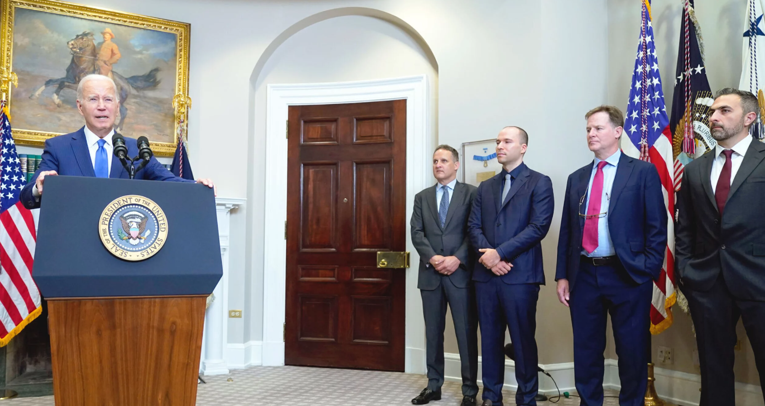 President Biden stands with Amazon CEO Andy Jassy and other leaders