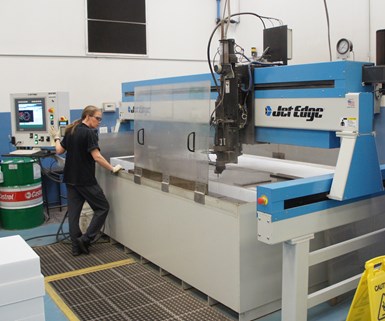 A large waterjet performs 2D cutting at composites manufacturer DeltaWing. 