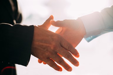 A stock photo of two people shaking hands