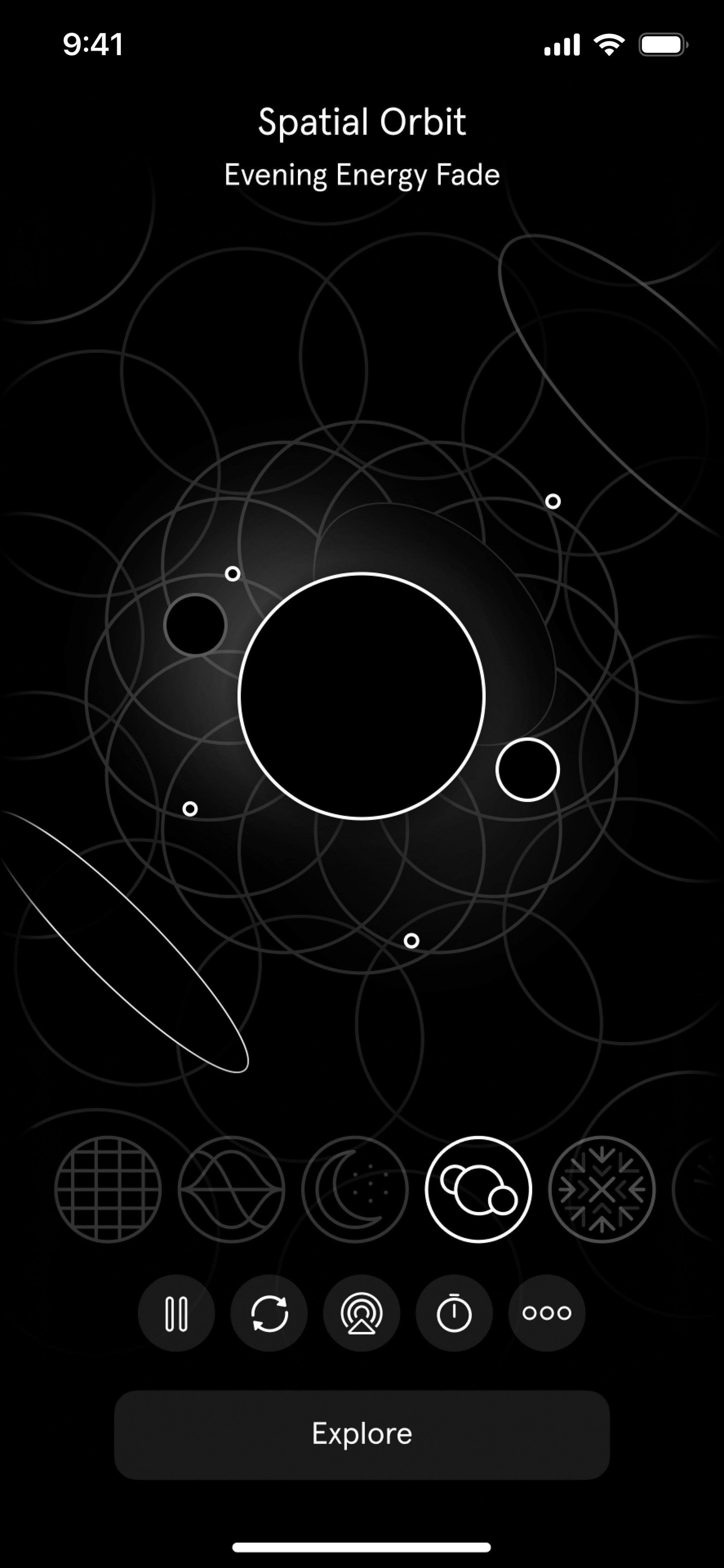 A screenshot of Endel’s Spatial Orbit soundscape, showing a series of abstract black circles with white borders on a largely black background. When the soundscape is playing, the circles move and shift with the sounds.