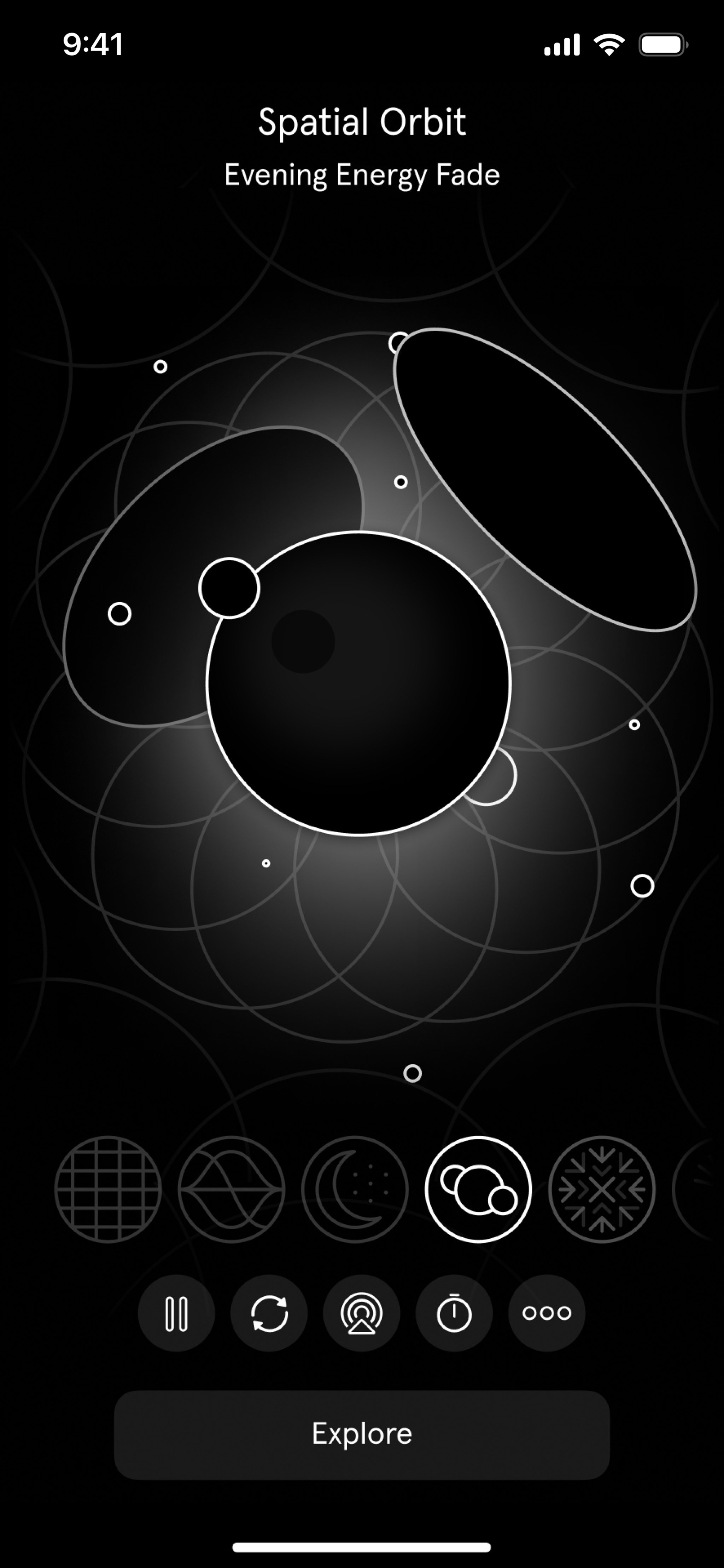 A screenshot of the Spatial Orbit soundscape in the immersive sound app *Endel*, showing a series of abstract black circles on a mostly black background. 