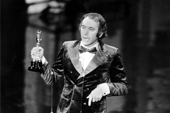 FILE - Producer Albert S. Ruddy accepts the Oscar for best picture for "The Godfather" at the 45th Annual Academy Awards ceremony in Los Angeles, Calif., on March 27, 1973. The Canadian-born producer and writer who won Oscars for “The Godfather” and “Million Dollar Baby,” died Saturday, May 25, 2024, at age 94. (AP Photo, File)