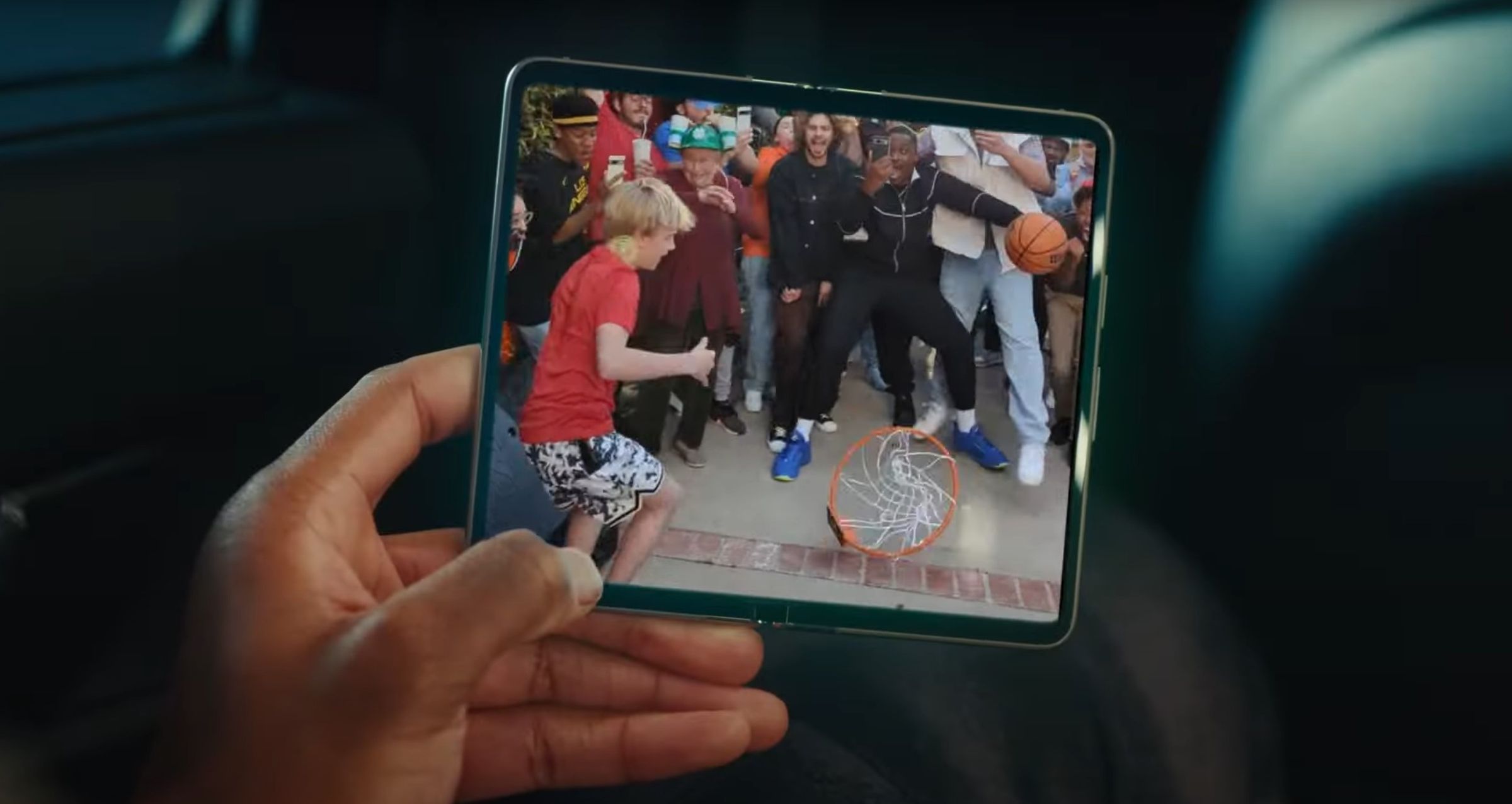 Screenshot taken from the “Google Pixel x NBA: The Greatest Watch Party” ad that shows the Pixel Fold being handled in everyday situations.