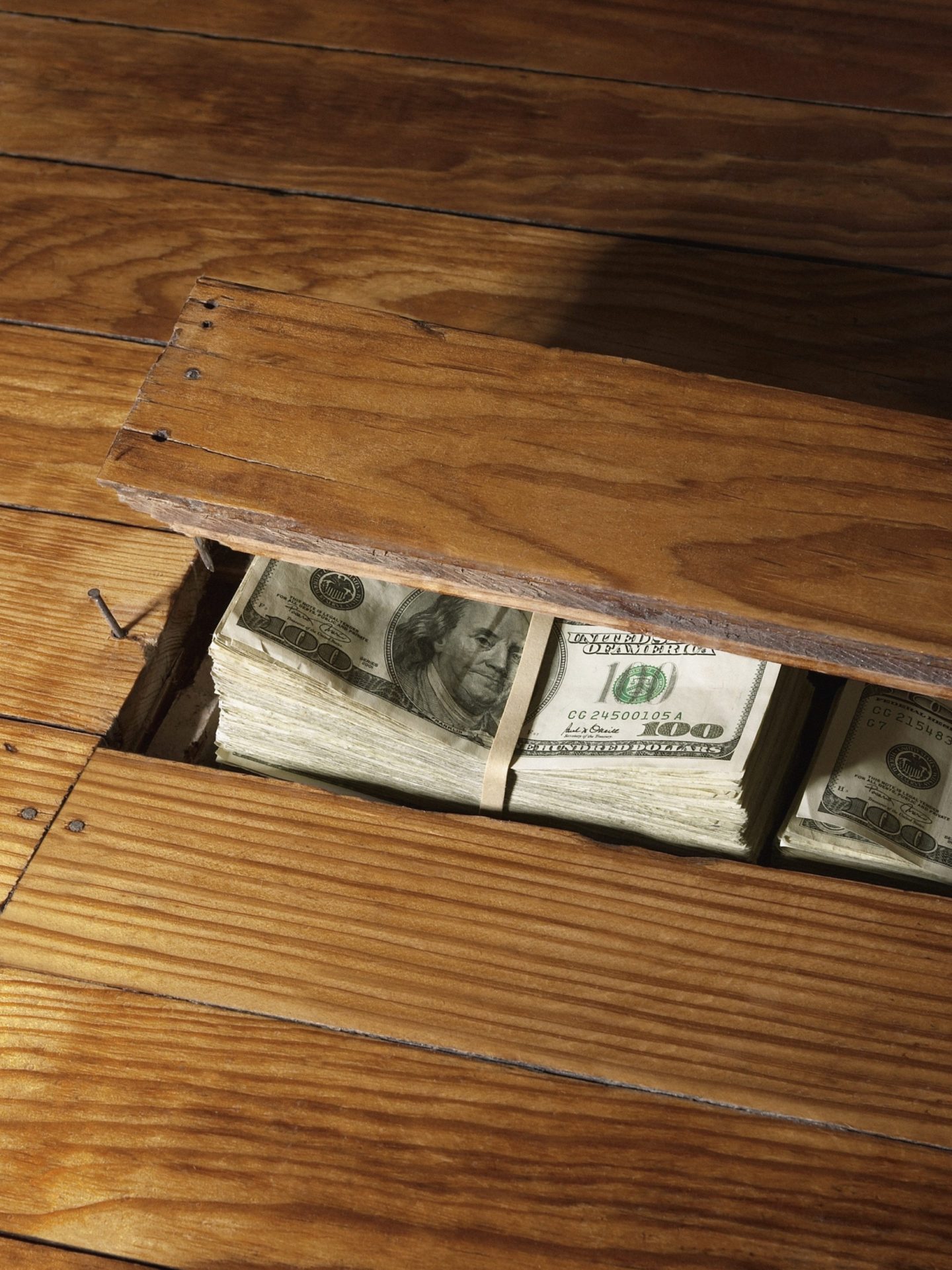 100 Dollar Bills Under Floor