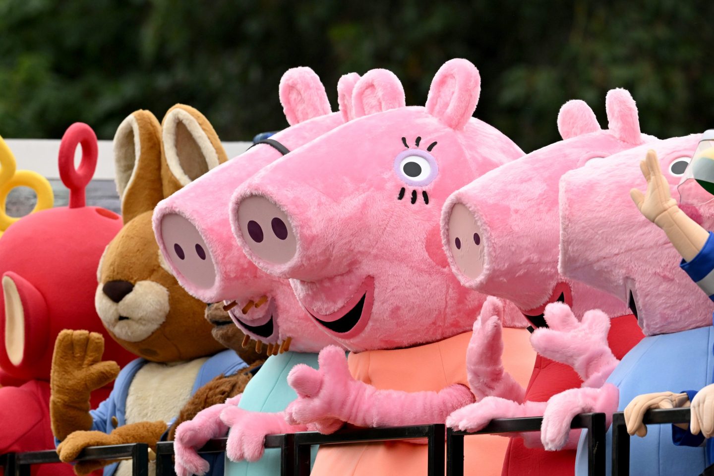 peppa pig mascots standing in a row