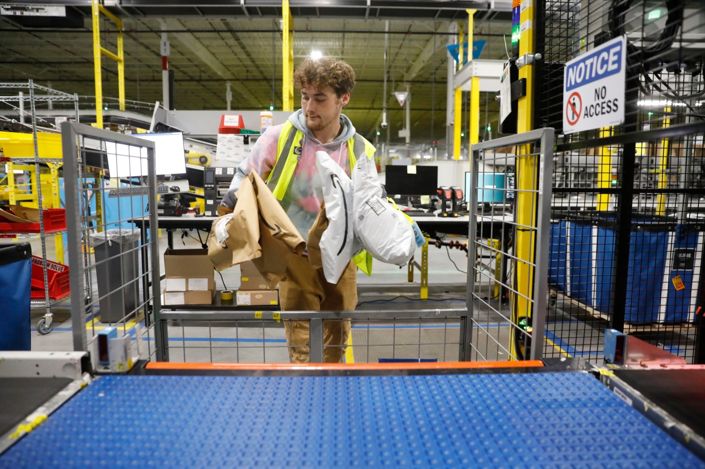 TAMPA, FLORIDA &#8211; NOVEMBER 27: Amazon associate Zachary Binder works to ship out same day orders during Cyber Monday at the Same-Day Delivery Facility Fulfillment Center on November 27, 2023 in Tampa, Florida. Dedicated to online shopping, Cyber Monday is one of Amazon&#8217;s busiest days following Thanksgiving, marked by retailers providing substantial discounts and promotions. (Photo by Octavio Jones/Getty Images)