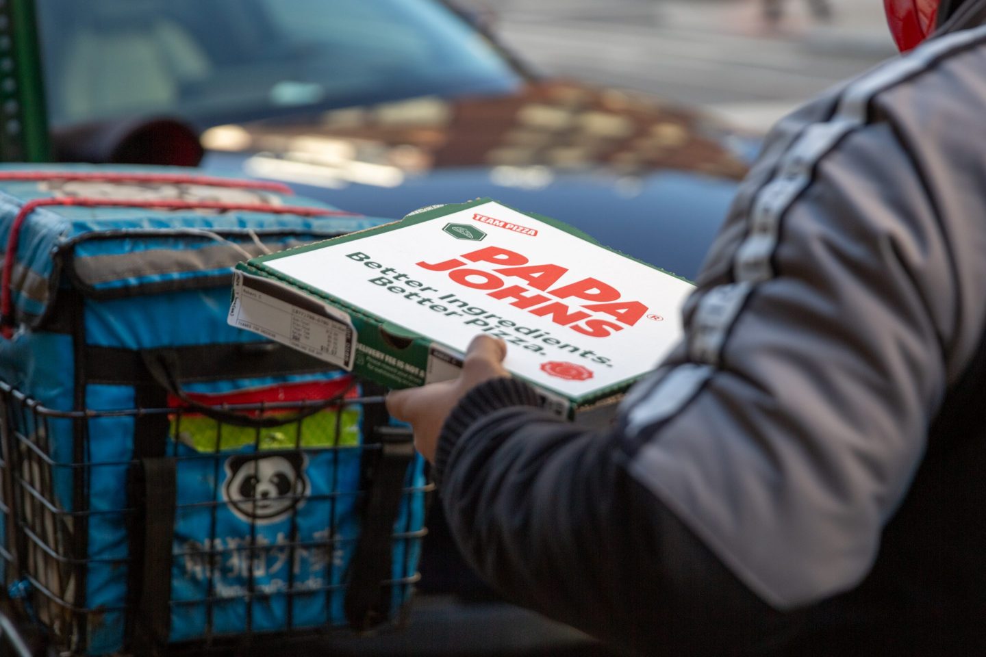 A delivery worker carries a Papa John&#8217;s pizza outside a restaurant in New York, US, on Sunday, Feb. 25, 2024. Papa John&#8217;s International Inc. is scheduled to release earnings figures on February 29. Photographer: Shelby Knowles/Bloomberg via Getty Images