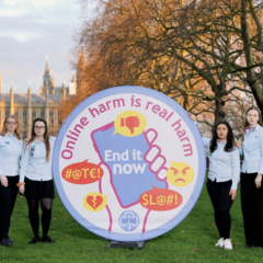 Advocates from Girlguiding U.K. unveil a badge urging an end to online harms ahead of meeting in London with members of Parliament to discuss the Online Safety Bill on Feb. 9, 2022.