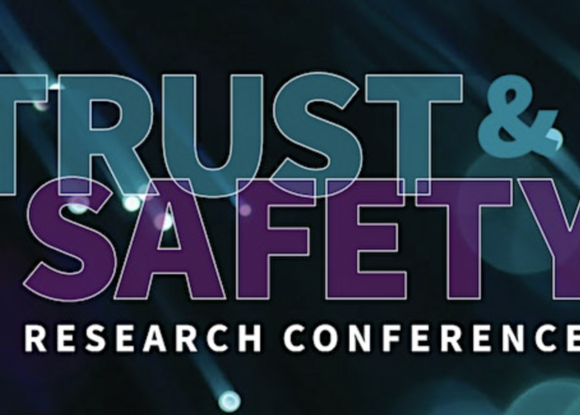 turquoise and purple text that reads "trust and safety research conference" on a dark background