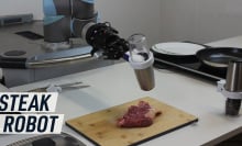 Dino Robotics robot cooking a steak