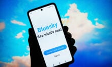 Bluesky Social logo of a social network is seen on a smartphone screen.