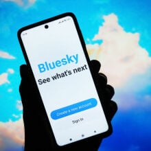 Bluesky Social logo of a social network is seen on a smartphone screen.