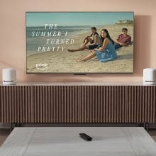 amazon fire stick on coffee table on tv with 'the summer i turned pretty' still 