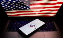 A photo of the U.S. flag and a broken phone screen with the TikTok logo on it 