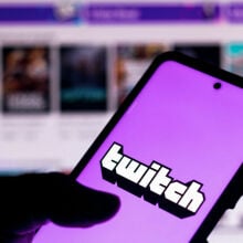 In this photo illustration the Twitch logo seen displayed on a smartphone.