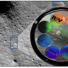 The moon, zoomed in on a landing site, with a disk covered in smaller colorful disks