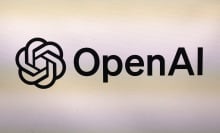 The OpenAI logo printed on a textured surface