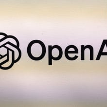 The OpenAI logo printed on a textured surface