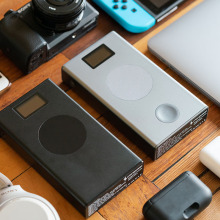 Devices on table with earbuds
