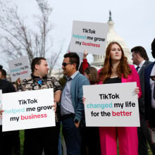 Participants hold signs in support of TikTok outside the U.S. Capitol Building on March 13, 2024 in Washington, DC.