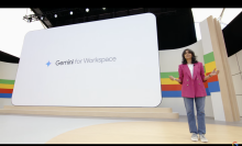 A woman on a stage in front of a screen with the words Gemini for Workspace