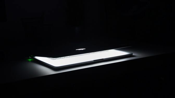 Laptop in dark room