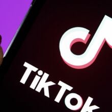 In this photo illustration, the TikTok logo is displayed on the screen of an iPhone.