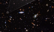 This deep field view from the James Webb Space Telescope shows (in the box) the oldest-known galaxy ever discovered.