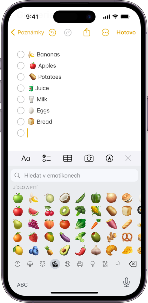 V aplikaci Poznámky je v horní polovině obrazovky otevřena poznámka a v dolní polovině obrazovky je vidět klávesnice s emotikony.