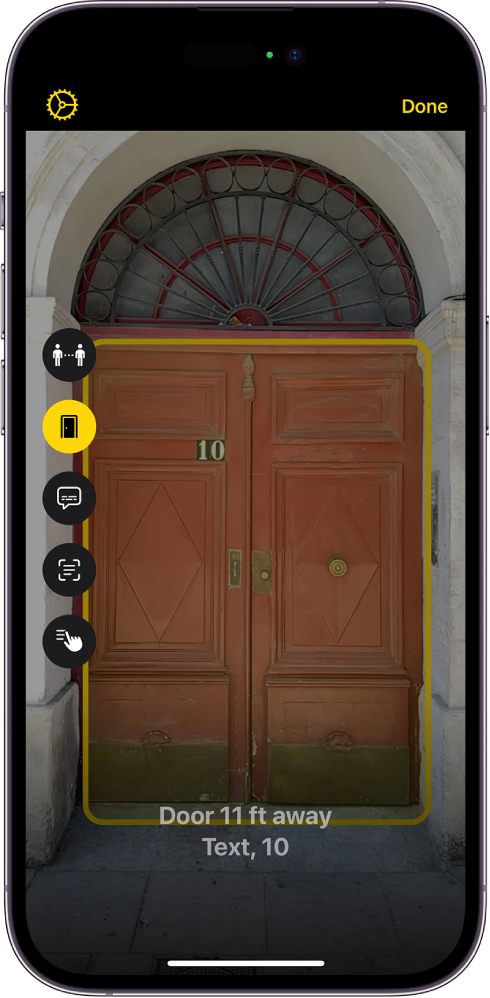 The Magnifier screen in Detection Mode showing a door. At the bottom is a description of how far away the door is and the number on it.