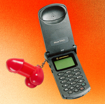 a black phone with a red, penis shaped key chain