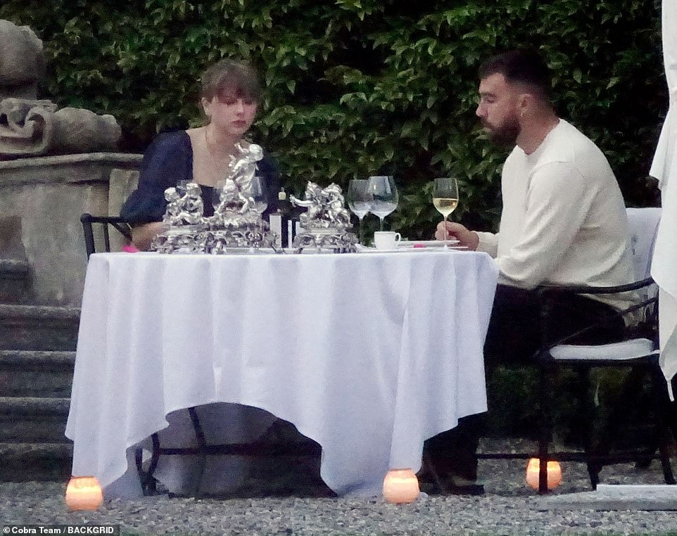 The couple sipped on wine as they relaxed under the stars