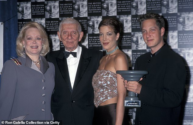 Iconic family: Randy was born when his multimillionaire producer father was 55, five years after the birth of sister Tori -pictured with Tori, Aaron and mom Candy in 1999