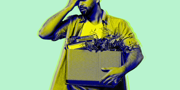Person holding box laid off on green background 2x1